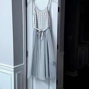 This is a nice, formal, dressy girls style dress. It can be good for gatherings!